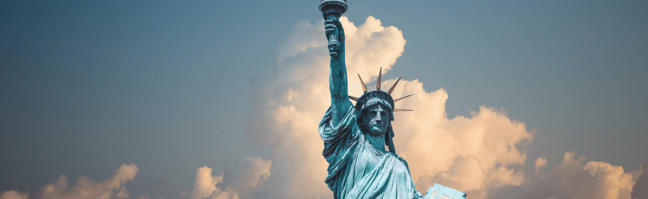The Statue of Liberty holding a torch, symbolizing enlightenment and freedom.
